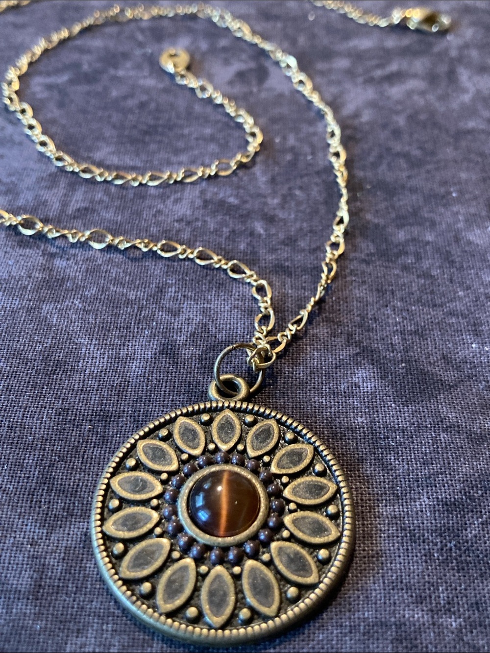 Gold-Tone Sunburst Pendant Necklace with Brown Cats Eye Cabochon